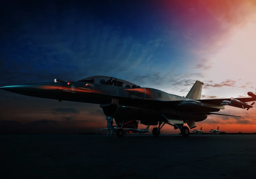 Fighter jet on a runway at sunset with a dramatic sky in the background.